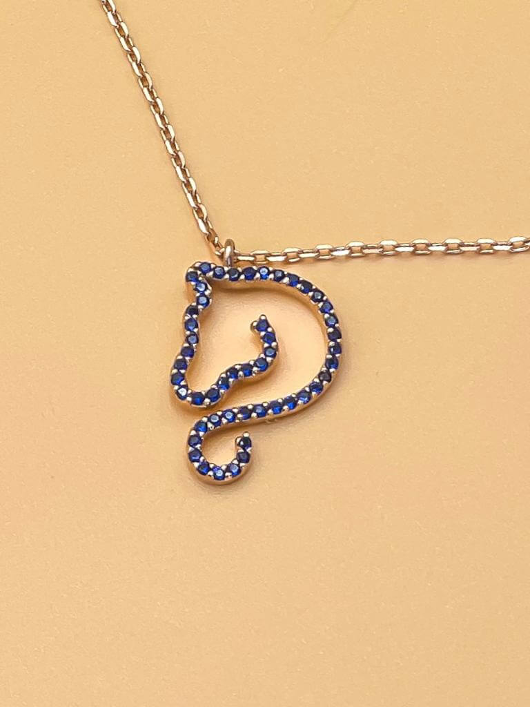 Equine Elegance Necklace featuring a horse-shaped pendant with blue zircon stones on a delicate silver chain.