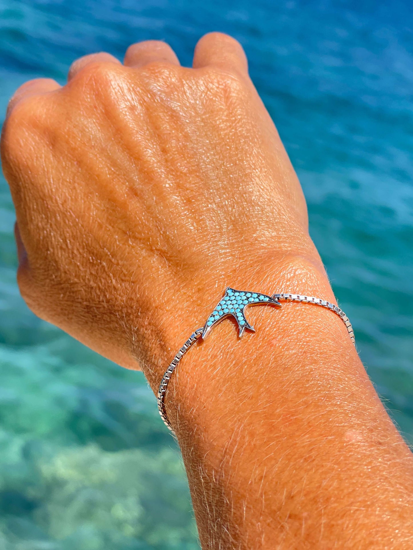 Adjustable handmade 925 sterling silver bracelet with natural stone detail on wrist, elegant summer jewelry by the sea