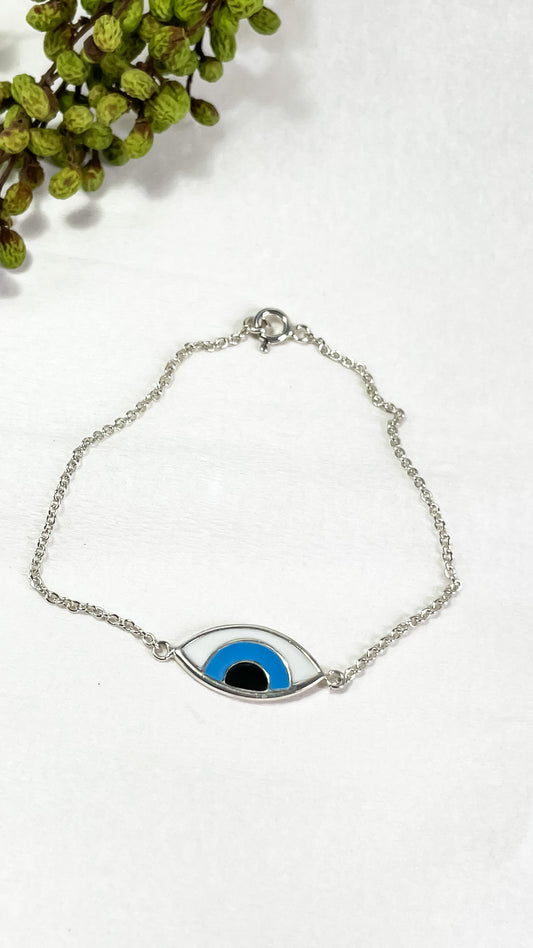 Evil eye silver necklace on display, designed to protect and repel negative energies while adding an elegant touch to any outfit.